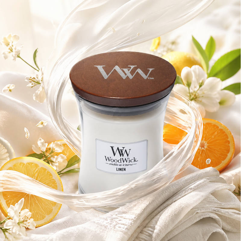 Woodwick Linene illatú közepes üveggyertya